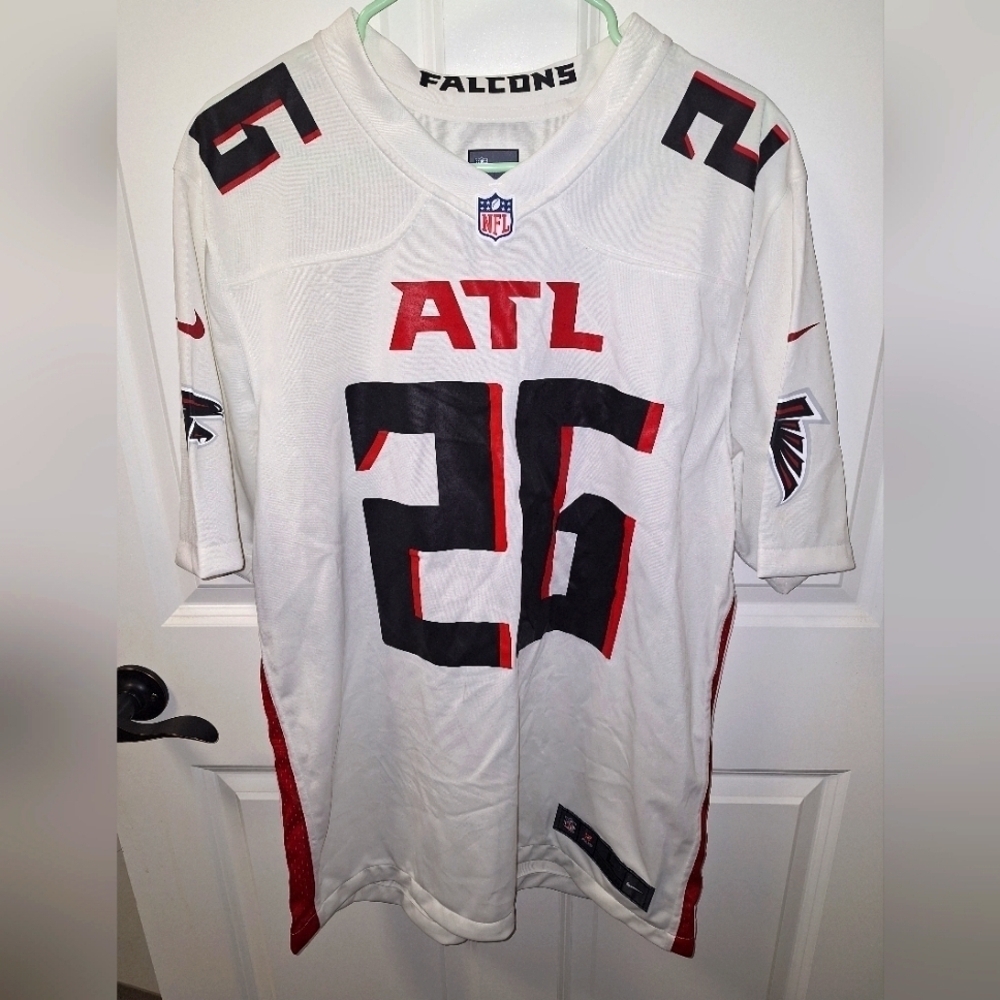 A Nike official NFL Atlanta Falcons #26 "Its in my DNA" jersey in a men's large.
